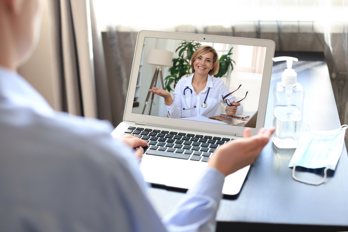 patient receiving concierge medical services virtually on a laptop