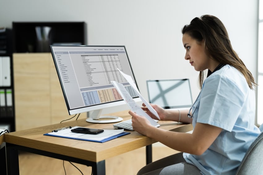 woman doing medical billing for a dermatology practice